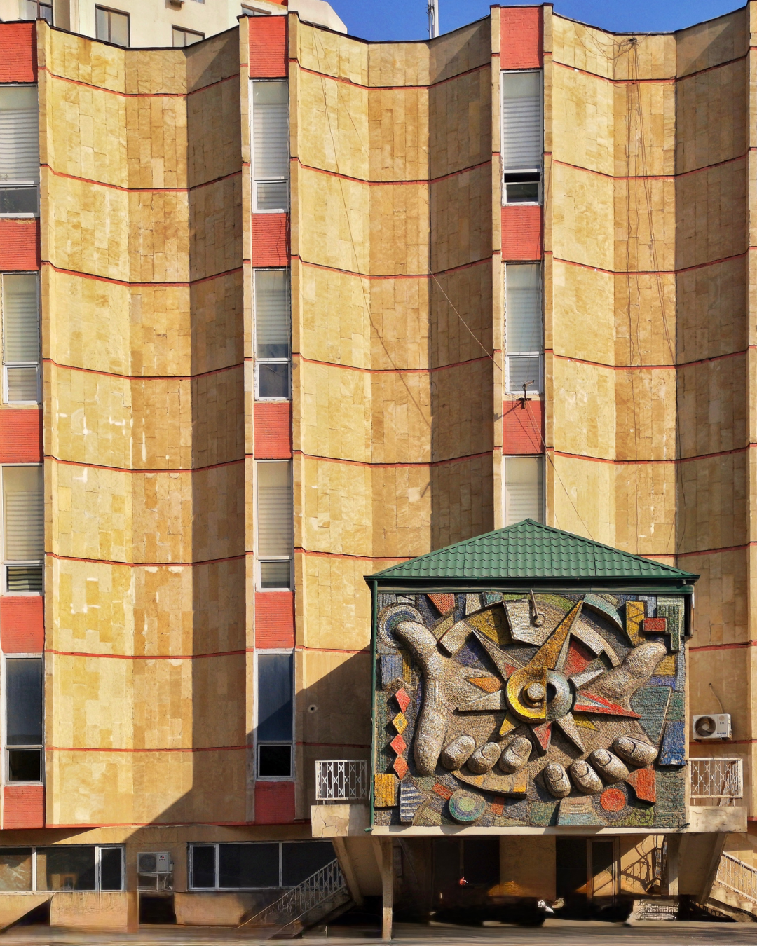 Soviet Mosaic "Progress" with background of massive prefabricated wall of an administrative office. Mosaic Artist: Ogtay Shikhaliyev