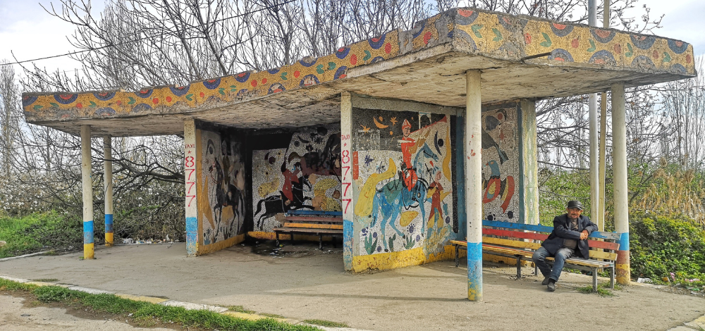 Colorful mosaic Soviet Bus Stop in Guba, Azerbaijan, decorated with national-traditional folkloric motifs blending with Socialist functionalism.